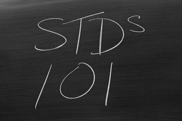 The words "STDs 101" on a blackboard in chalk