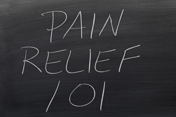 The words "Pain Relief 101" on a blackboard in chalk