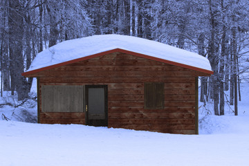 Little hut in the snow