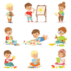 Little Kids In Art Class In School Doing Different Creative Activities, Painting , Working With Putty And Cutting Paper.