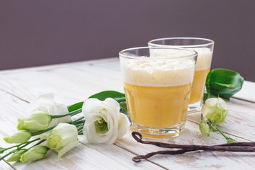 Traditional Homemade Eggnog and white eustoma flowers