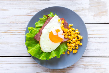 Toast with orange yolk fried egg for breakfast