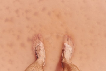 Men's feet in salt lake