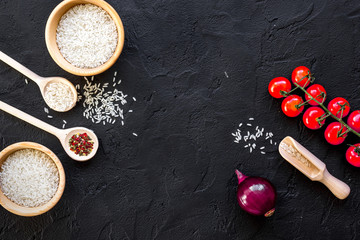 ingredients for paella on dark background top view
