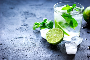 mojito in glass on dark background close up