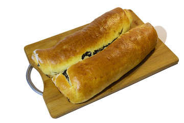 Poppy roll baked at home with on a wooden board Isolated on white background.