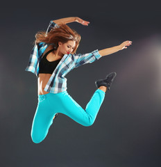 Hip hop dancer on dark background
