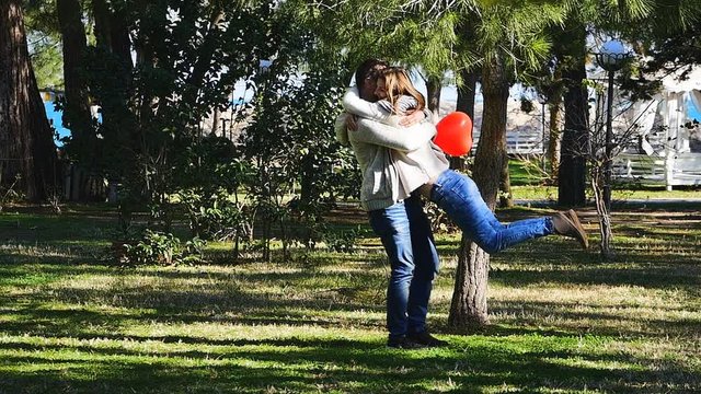 Funny couple running in a park