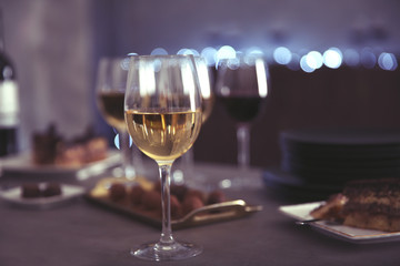 Wine and delicious chocolate desserts on table