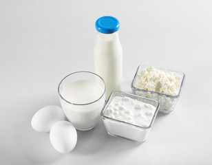 Different dairy products on light background