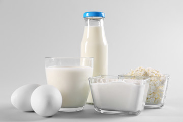 Different dairy products on light background
