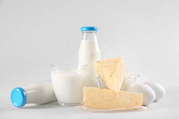Different dairy products on light background