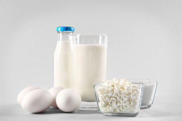 Different dairy products on light background