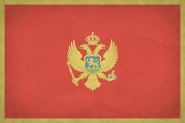Grunge Montenegro flag pattern  on crumpled kraft paper