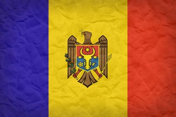 Vintage Moldova flag background  on crumpled sack paper