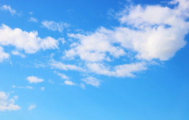Naklejka na ściany i meble Gorgeous summertime white clouds in the blue sky 