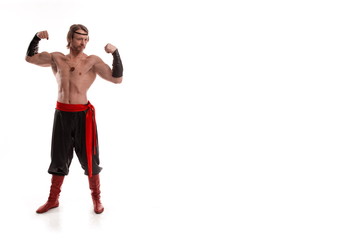 Actor Athlete man in trousers with naked torso posing on a white background in studio