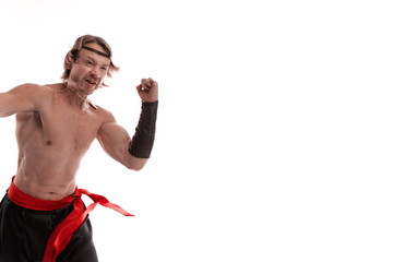 Actor Athlete man in trousers with naked torso posing on a white background in studio