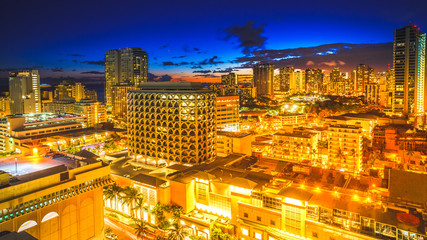 Aerial view night life of Waikiki skyline in Oahu island Hawaii, United States. City night lights...