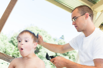 Little Boy With Downs Syndrome Getting His Haircut