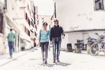 Senior Couple Walking Through The Streets Of Tuebingen,