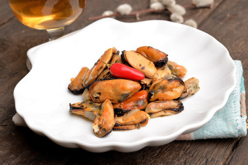 Shelled mussels on plate on the table