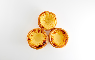 3 tasty Portugese Custard Tarts with reflection isolated on white background