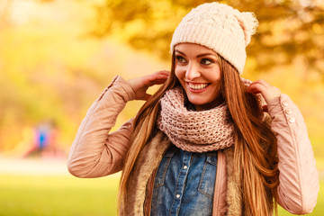 Woman with scarf and cap.