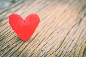 Fototapeta premium Valentine day red heart on old wood ,Hipster tone and soft focus