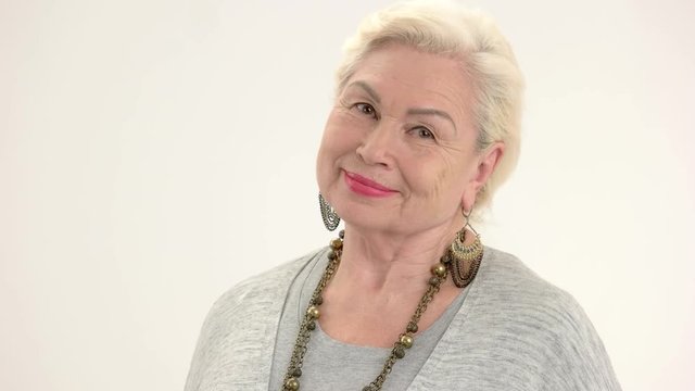 Senior woman isolated. Lady smiling on white background. Self confidence tips.