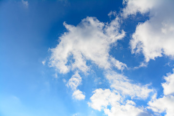 white clouds on light sky