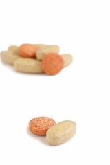 Vitamin Tablets on White Background