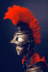 Mannequin in helmet with red feathers