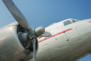 Close up on old airplane (biplane) with enormous propeller engine and cockpit