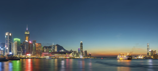 Obraz na płótnie Canvas Panorama of Victoria Harbor in Hong Kong at dusk