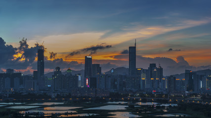 Naklejka premium Skyline of Shenzhen City, China at dusk. Viewed from Hong Kong border