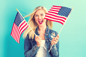Young woman holding American flag