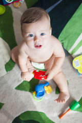 Fototapeta premium newborn baby smiling and playing at home