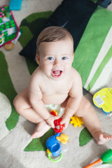 newborn baby smiling and playing at home