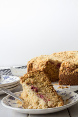 Raspberry Crumble Cake Served on a Plate Front Vertical with Copy Space