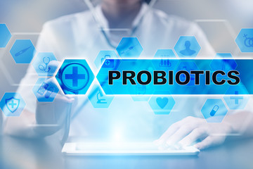 Medical doctor using tablet PC with probiotics medical concept.