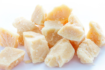 Hard cheese on a wooden background