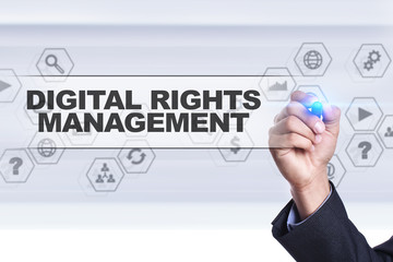 Businessman drawing on virtual screen. digital rights management concept.
