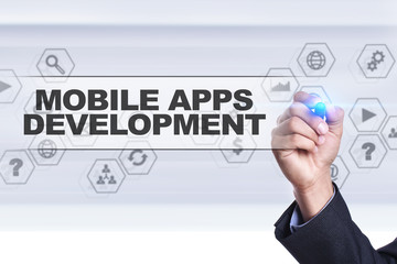Businessman drawing on virtual screen. mobile apps development concept.