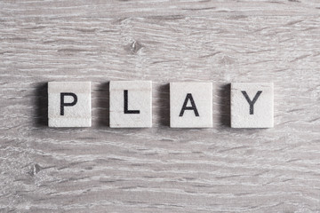 Fototapeta premium wooden elements with letter collected to word play