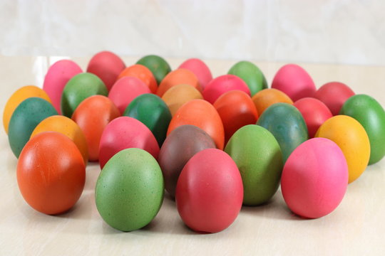 Multi color eggs on marble with copy space background for easter day
