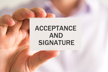 Businessman holding a card with ACCEPTANCE AND SIGNATURE message