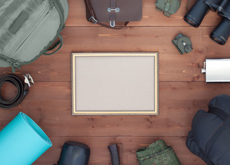 Top view photo on tourism, traveling with frame. Mockup flat lay concept. Tourist objects on wooden background. Stylized photo poaching or nature protection. Mock up. - 138793150