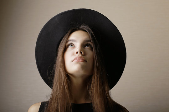 hipster girl in hat, studio
