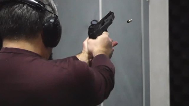 Man shooting with a pistol